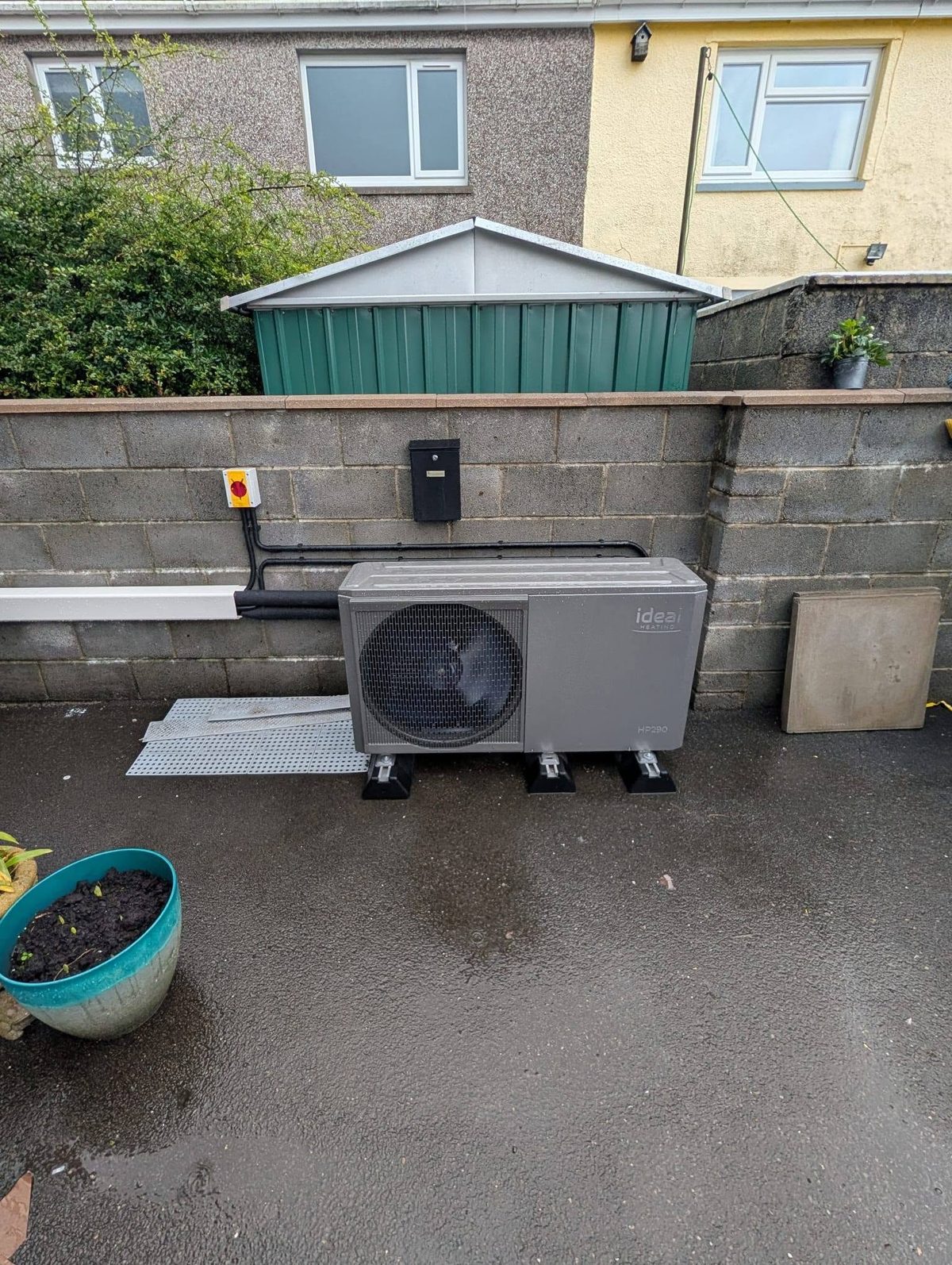 Ideal Logic air source heat pump installed outdoors on mounting feet